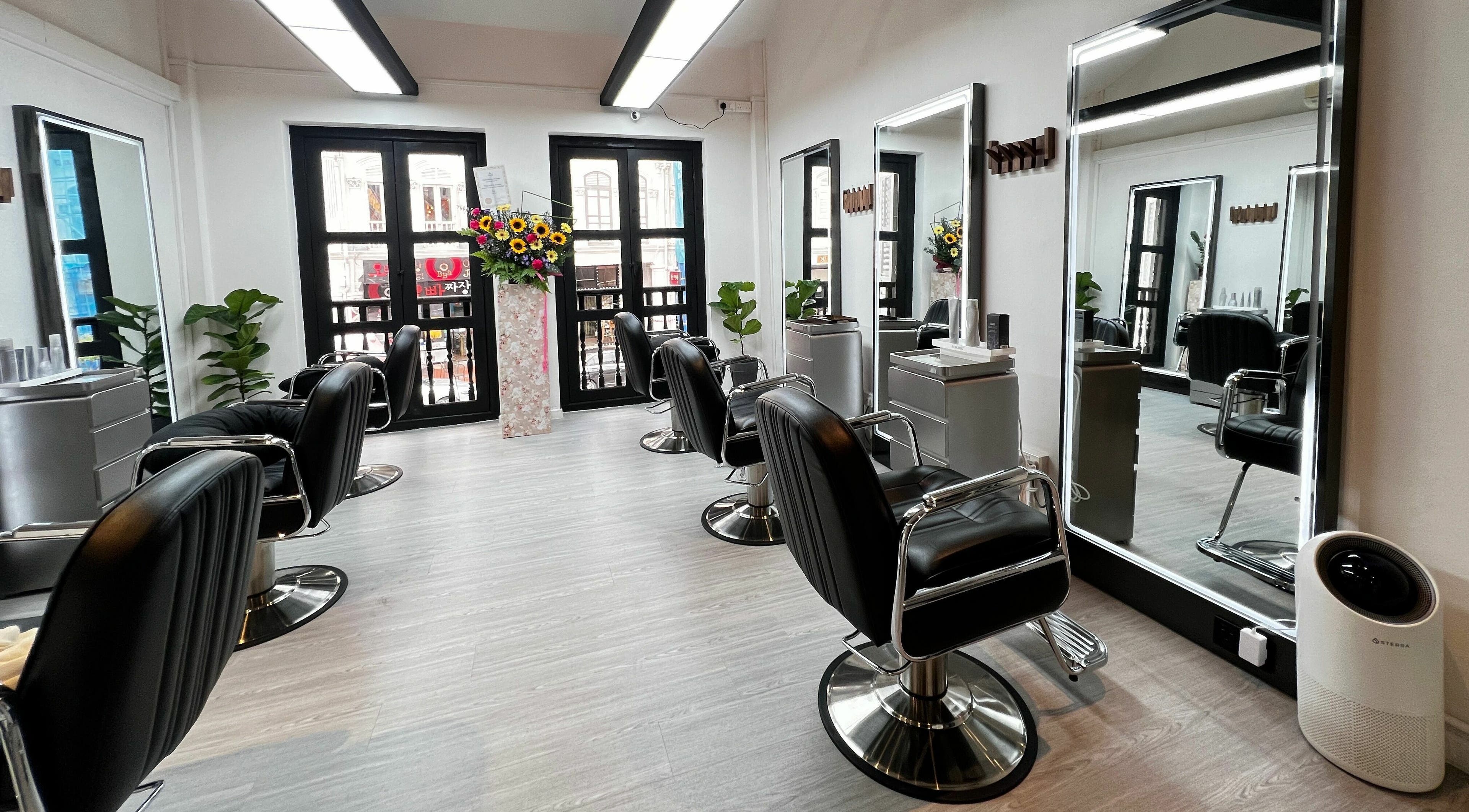 Eden Loft Hair Salon interior with sleek chairs and mirrors, Singapore, Singapore, SG.