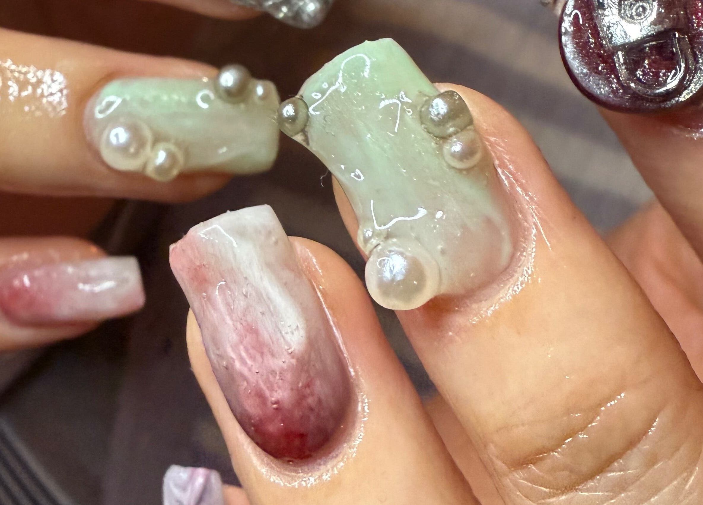 Unique pearl nail design at Journey to the Nails in London, England, GB, showcasing intricate artistry.