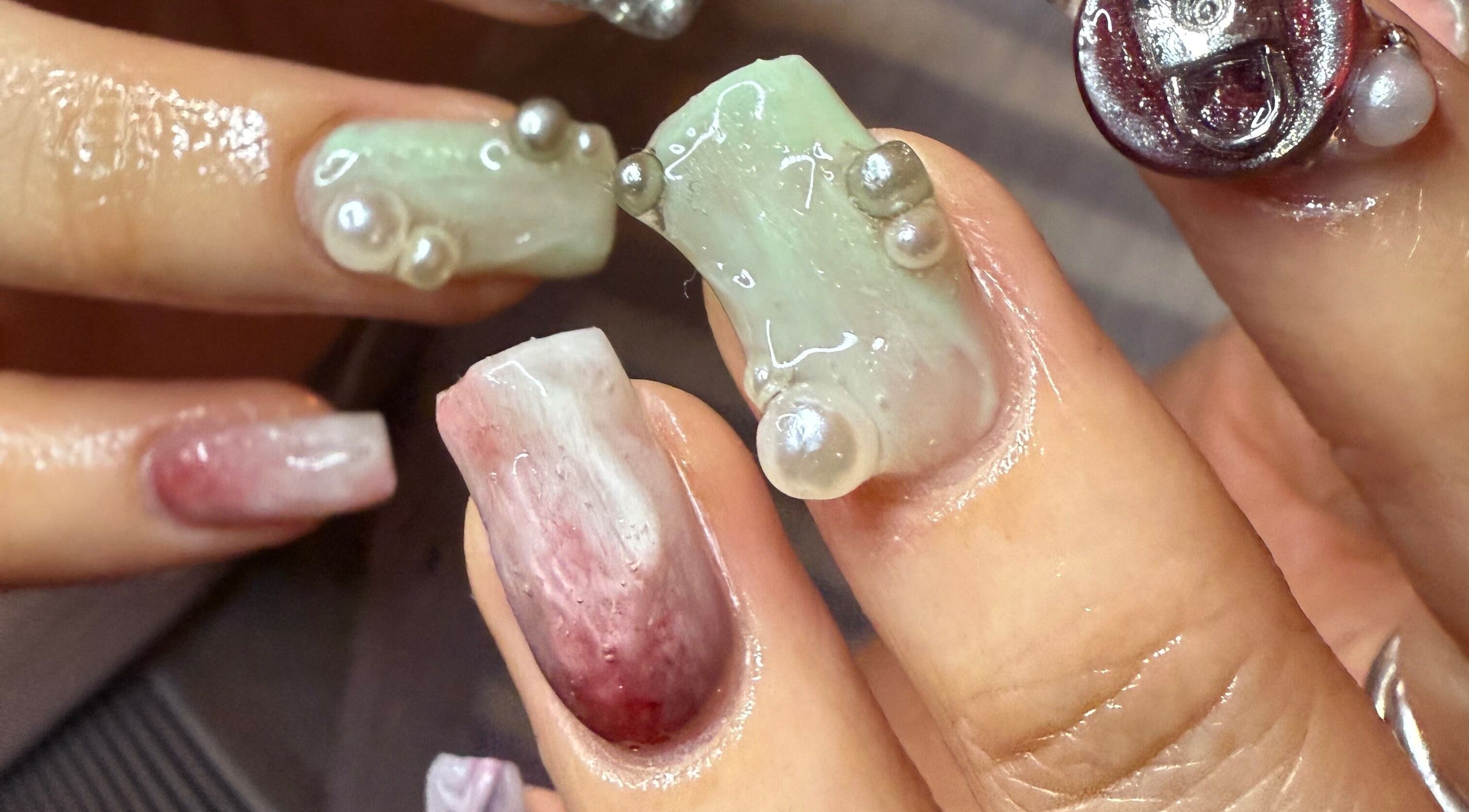 Unique pearl nail design at Journey to the Nails in London, England, GB, showcasing intricate artistry.