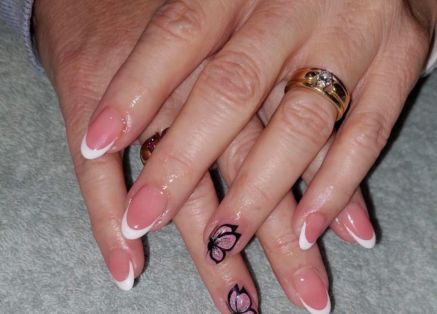 French manicure with floral art at Nail Artistry by Chelsea, Gqeberha, Eastern Cape, ZA.