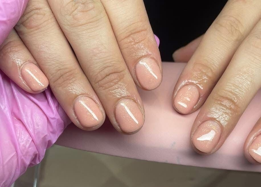 Expert nail art in Gqeberha by Nail Artistry by Chelsea showcasing glossy, pink manicure.