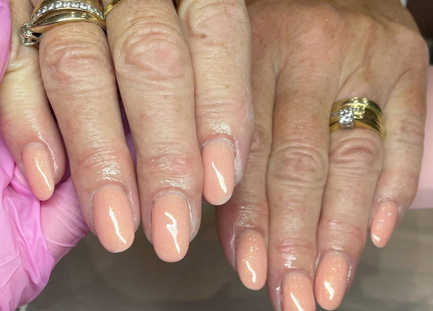 Elegant peach manicure at Nail Artistry by Chelsea in Gqeberha, Eastern Cape, ZA, showcasing polished nails.