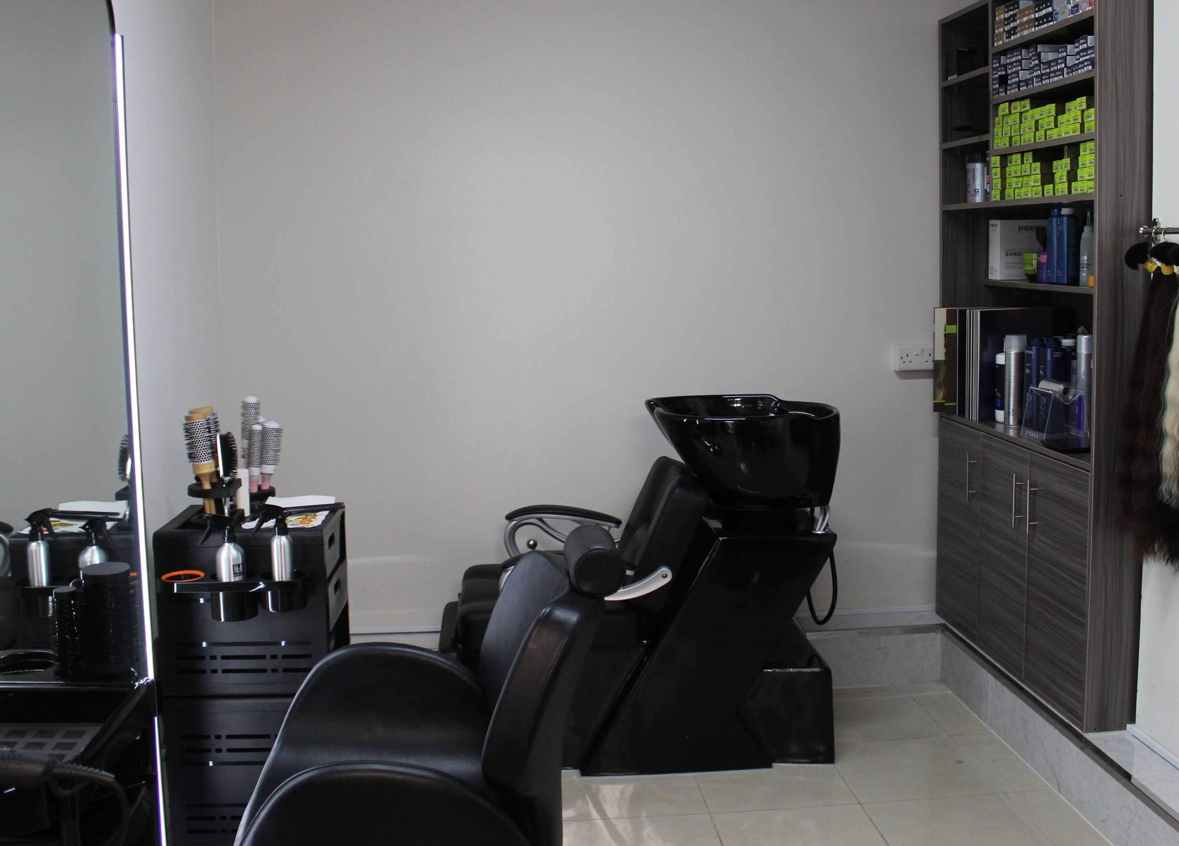 Modern interior of Lashes & Brows Studio Ladies Salon in Abu Dhabi, AE with chic salon chairs and equipment.