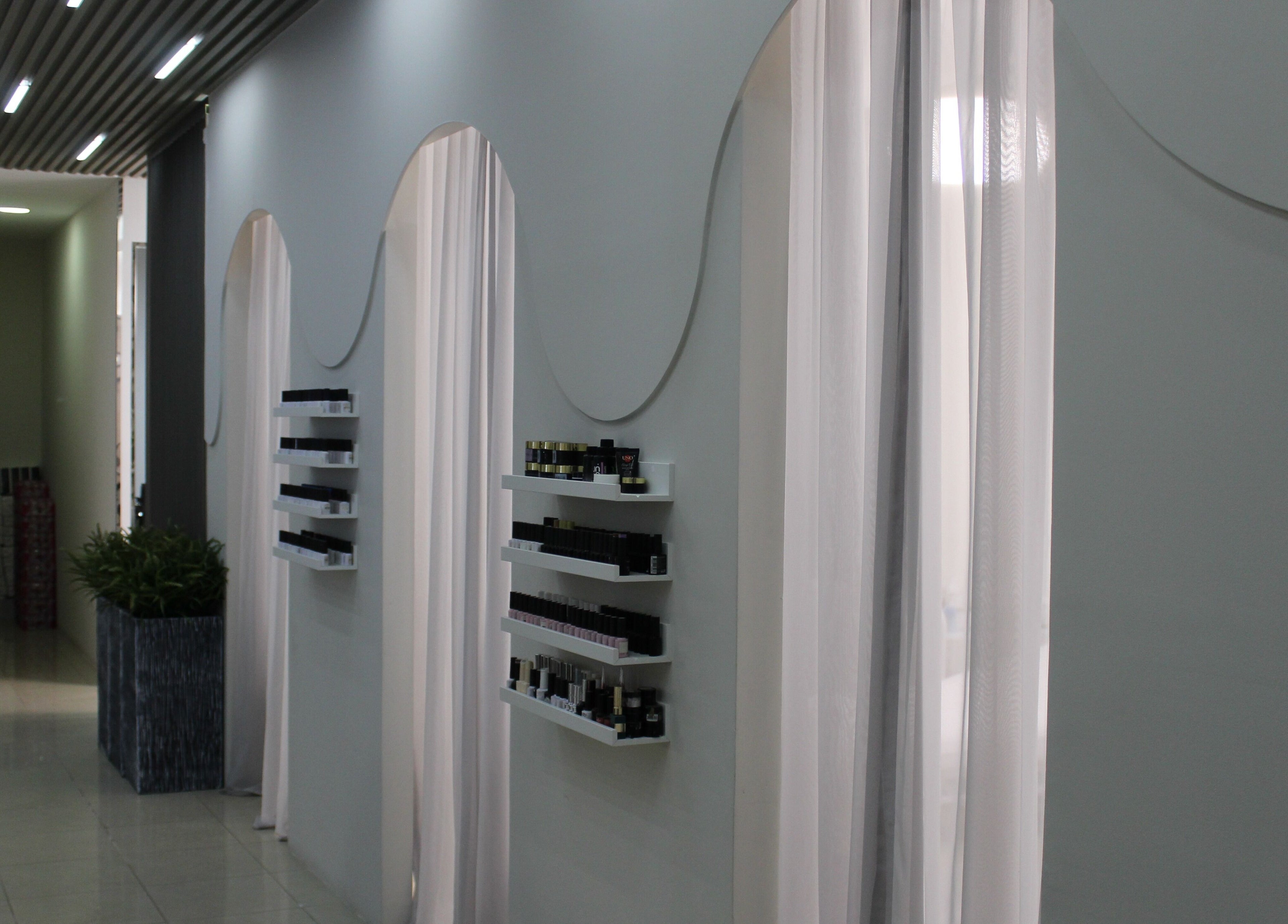 Serene corridor at Lashes & Brows Studio Ladies Salon in Abu Dhabi, AE with elegant shelving.