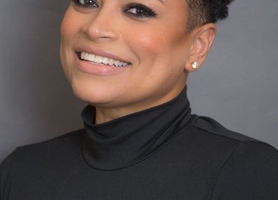 Smiling individual at The Brow Studio By Simone Najjar, Port of Spain, TT, showcasing beauty and confidence.