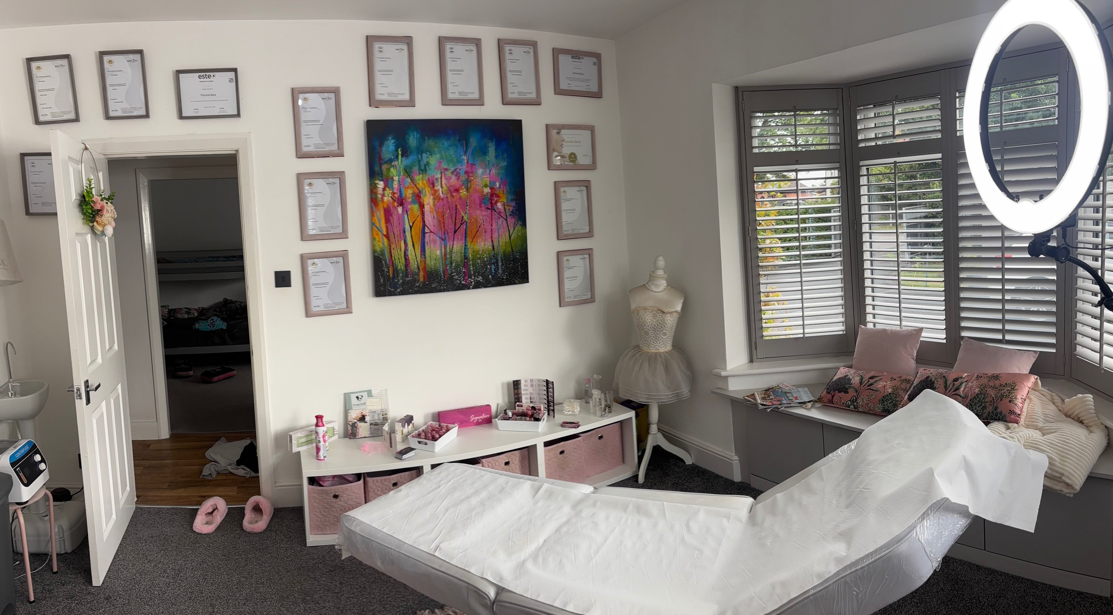 Interior of Permanent Aesthetics Studio in Burton Upon Trent, England, showcasing treatment space and decor.