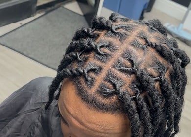 Intricate braided hairstyle at Princess Parlour in Nottingham, England, GB.