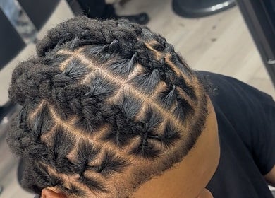 Detailed braid hairstyle at Princess Parlour, Nottingham, England, GB showcasing expert styling.