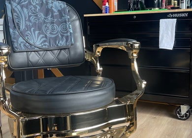 Luxurious barber chair at Black Sheep Barbershop in Kawartha Lakes, Ontario, CA, showcasing elegance and comfort.