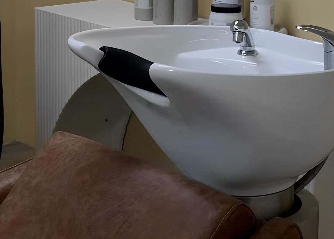 Modern wash basin and chair at Two by the Sea Salon, Christies Beach, South Australia, AU, enhancing client comfort.