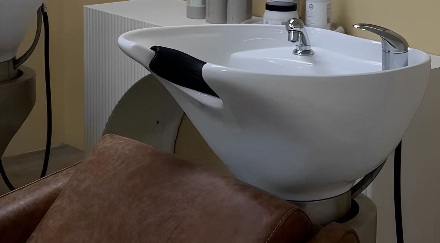 Modern wash basin and chair at Two by the Sea Salon, Christies Beach, South Australia, AU, enhancing client comfort.