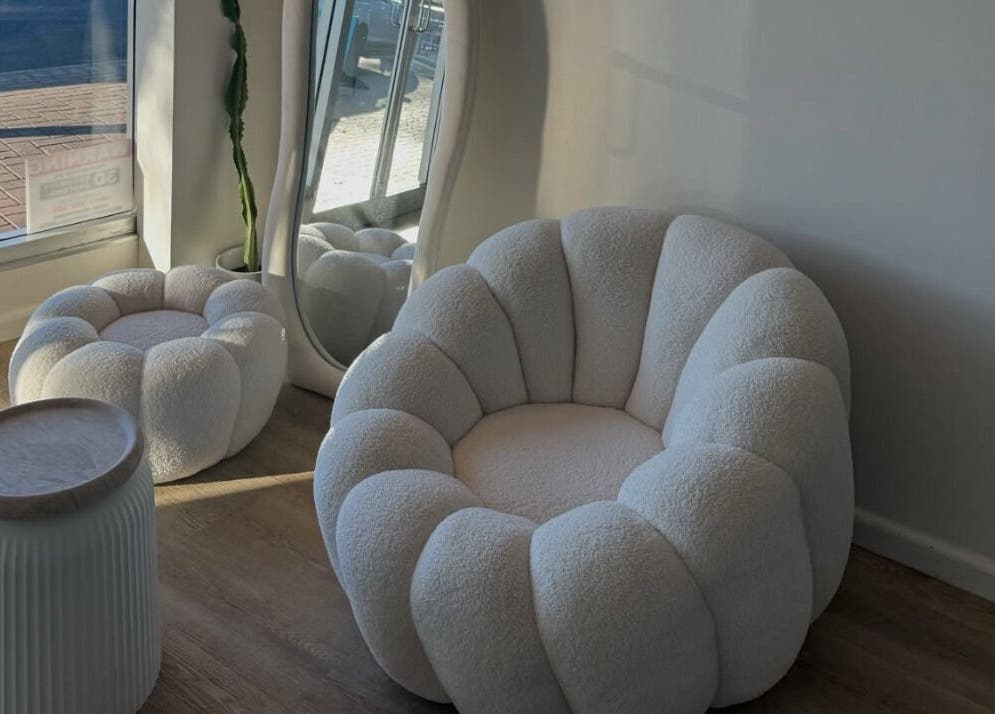Elegant seating area at Two by the Sea Salon, Christies Beach, South Australia, offering plush comfort and style.