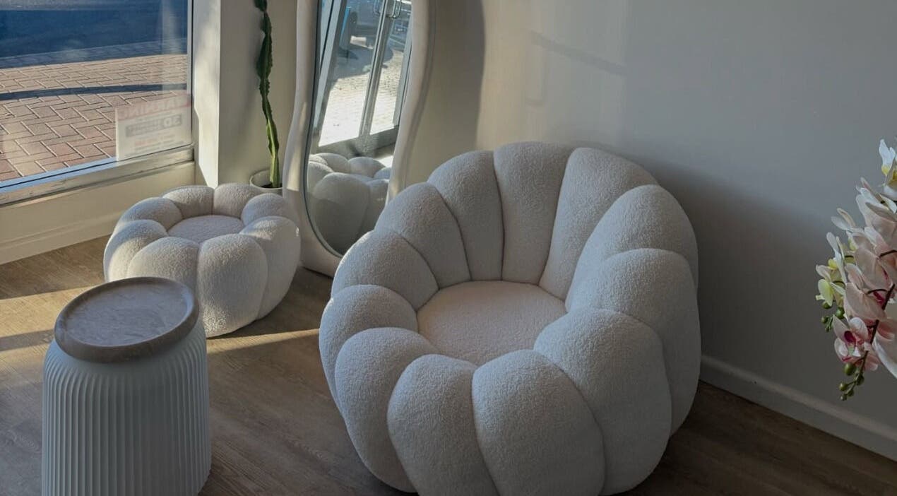 Elegant seating area at Two by the Sea Salon, Christies Beach, South Australia, offering plush comfort and style.