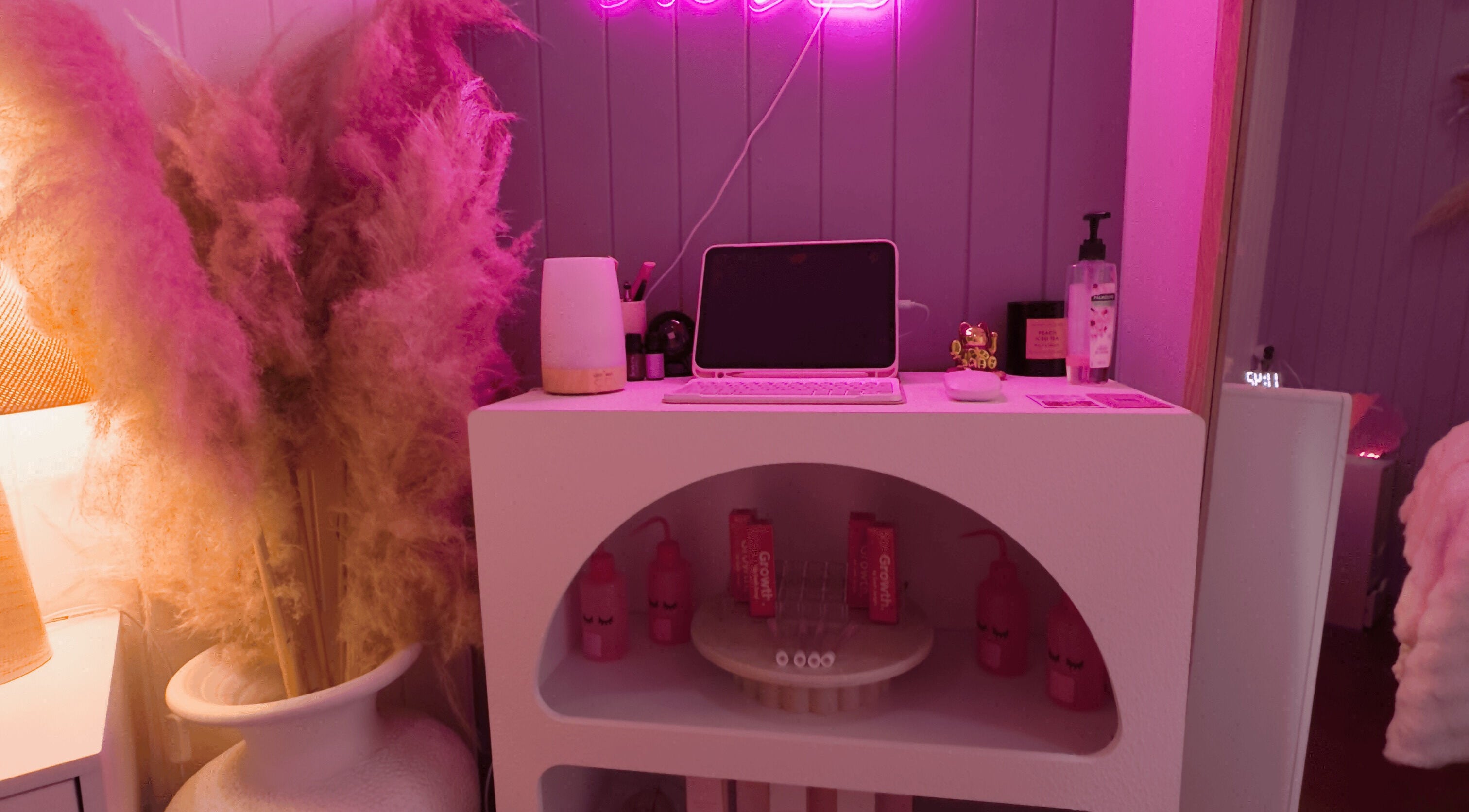 Chic Lyricstudiox beauty space with neon sign and pink accents in Saint Lucia, Queensland, AU.