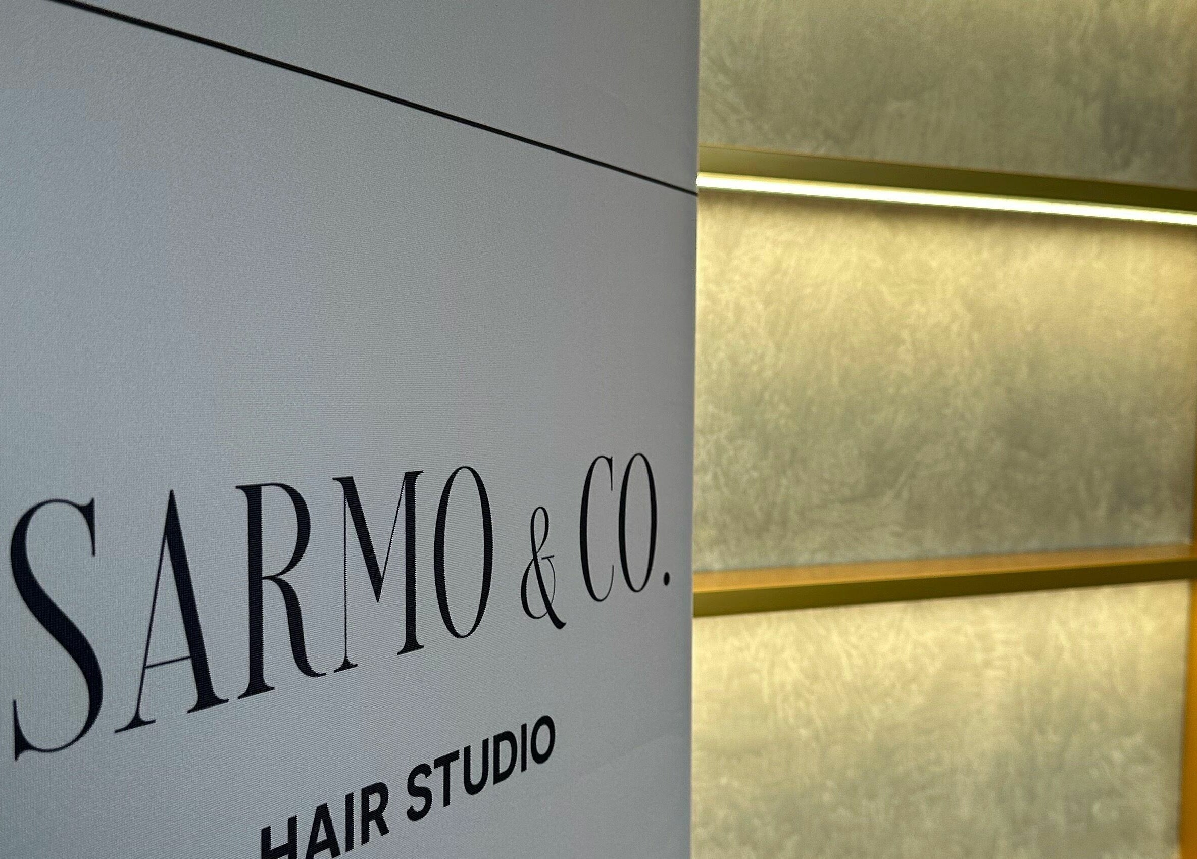 Sarmo & Co. hair studio sign in Melbourne, Victoria, AU, showcasing a modern and stylish design.