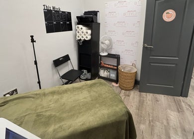 Cozy green treatment room at The Skin and Sculpt Studio, Ashton-under-lyne, England, GB.