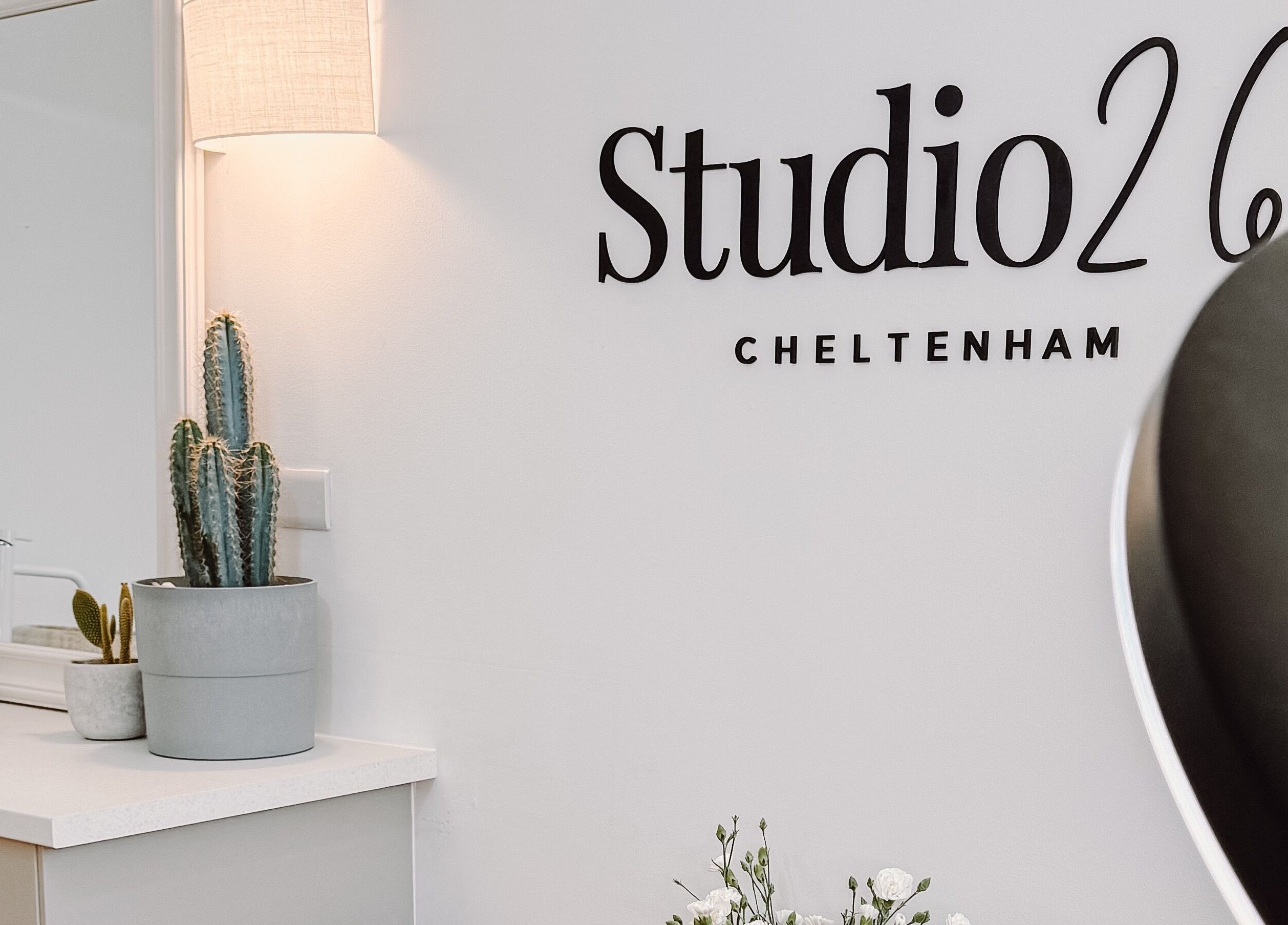 Elegant decor at Ola’s Studio26, a beauty venue in Cheltenham, England, GB, with stylish cacti and minimalist design.