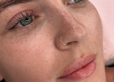 Close-up of a serene face post-treatment at Ola’s Studio26, Cheltenham, England, GB.