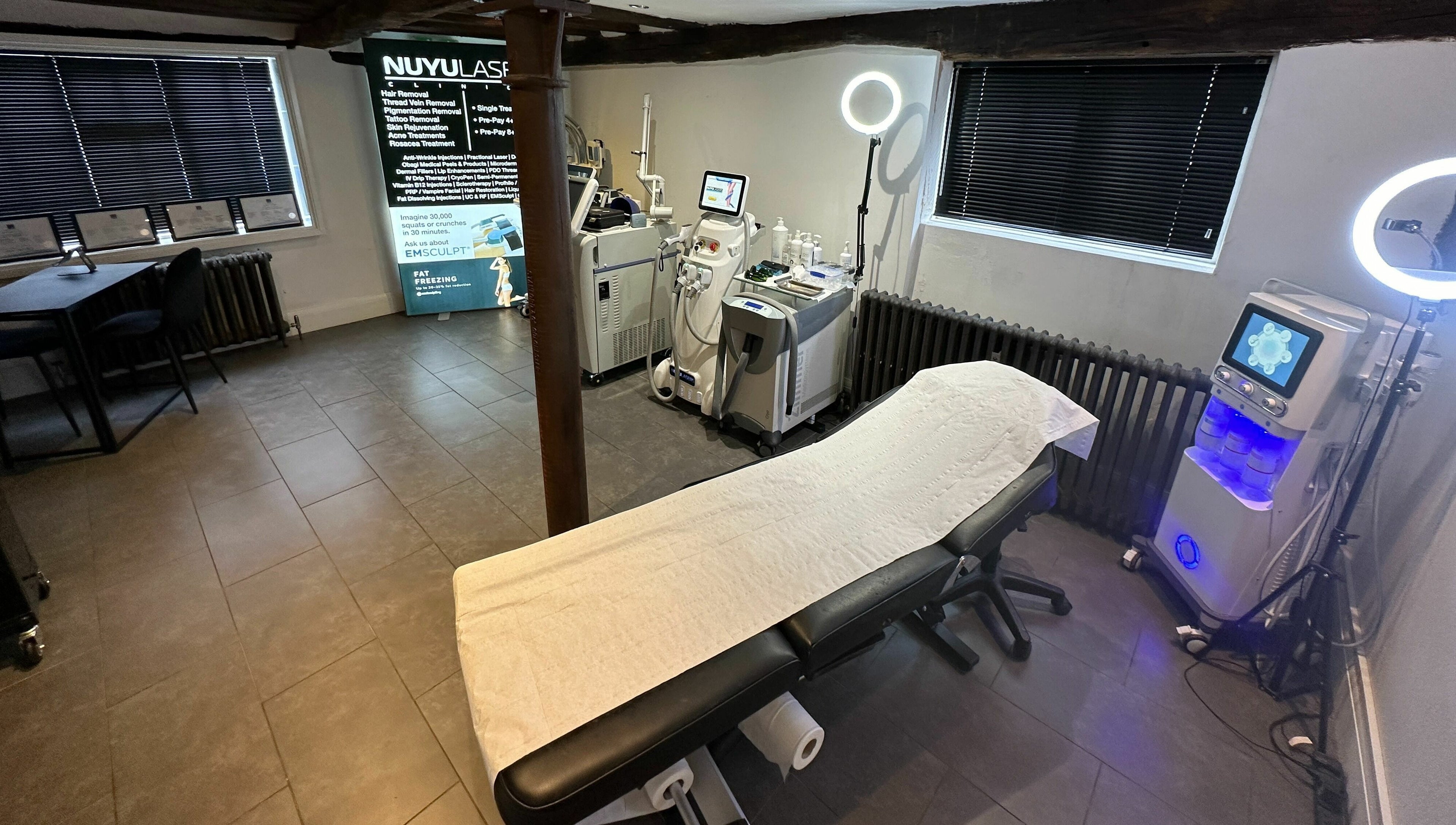 Modern treatment room at NUYU Laser & Aesthetics Clinics, Lichfield, England, GB, featuring advanced aesthetic equipment.
