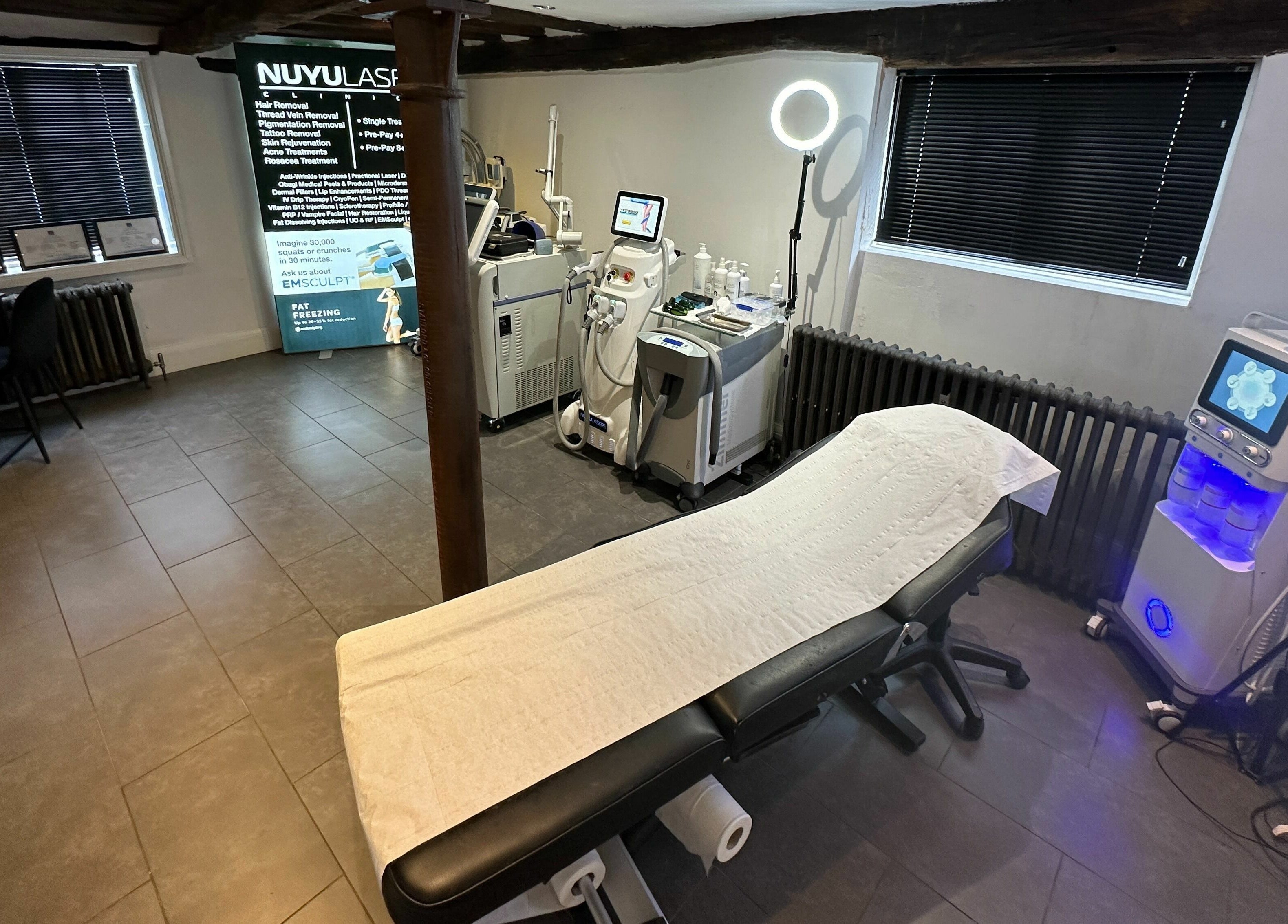 Modern treatment room at NUYU Laser & Aesthetics Clinics, Lichfield, England, GB, featuring advanced aesthetic equipment.