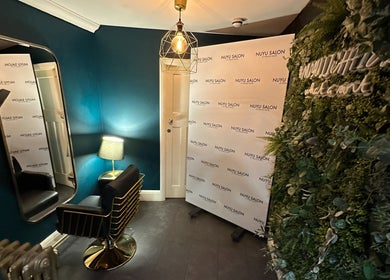 Elegant styling area at NUYU Hair & Beauty Salon Lichfield, Lichfield, England, GB with modern decor and lighting.