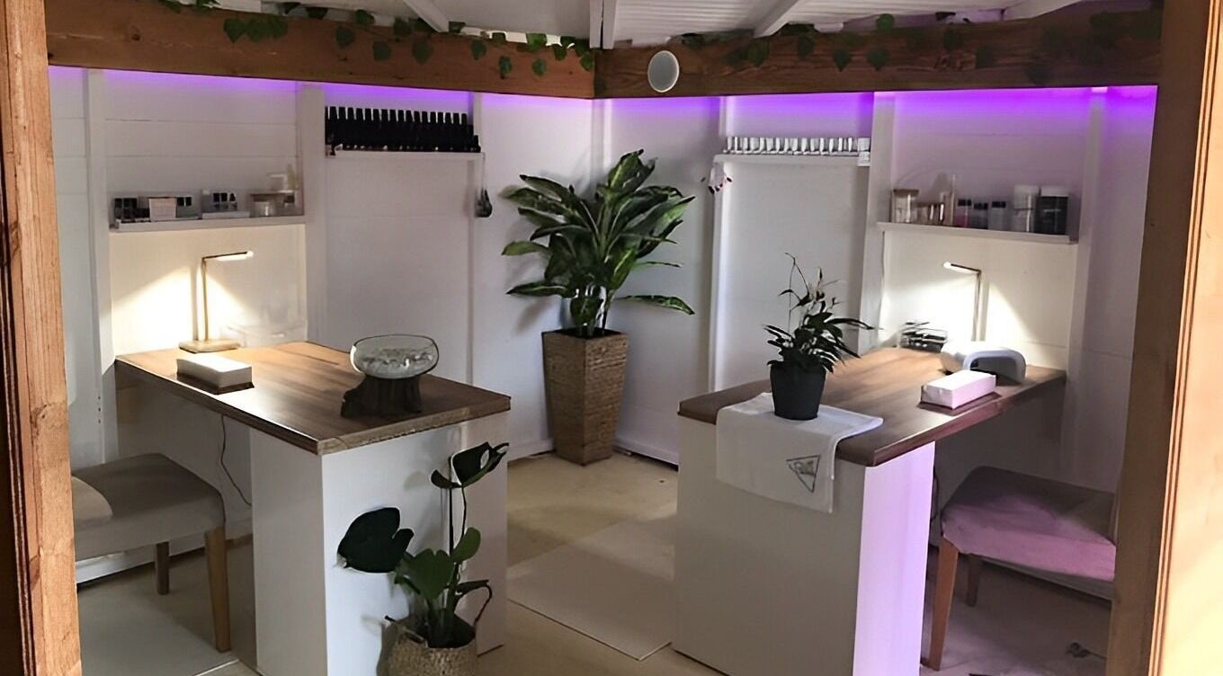 Calming interior of Menevia Bathhouse and Spa in St Davids, Wales, GB with ambient lighting and lush plants.