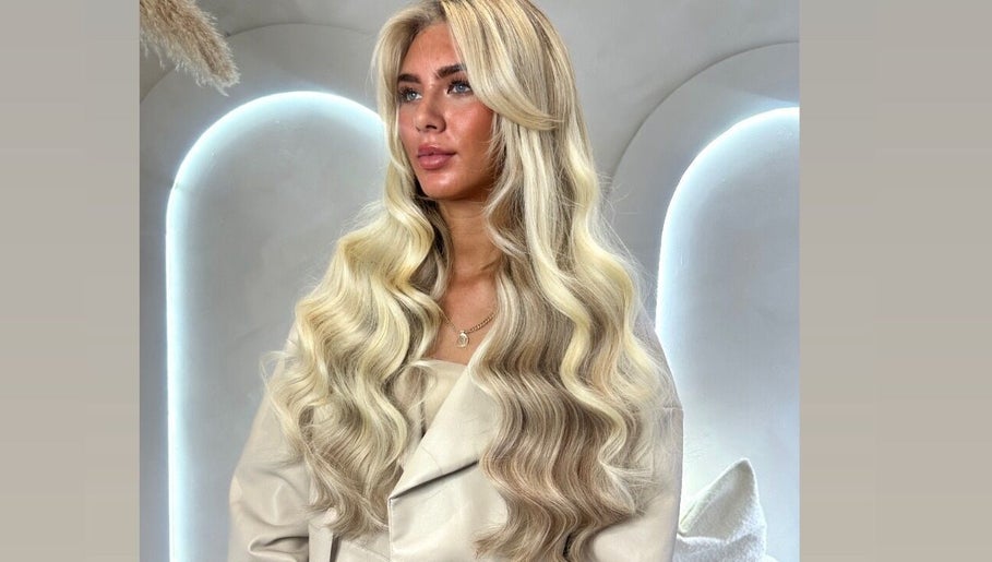 Glamorous long blond waves styled at Slae Salon, North Shields, England, GB.