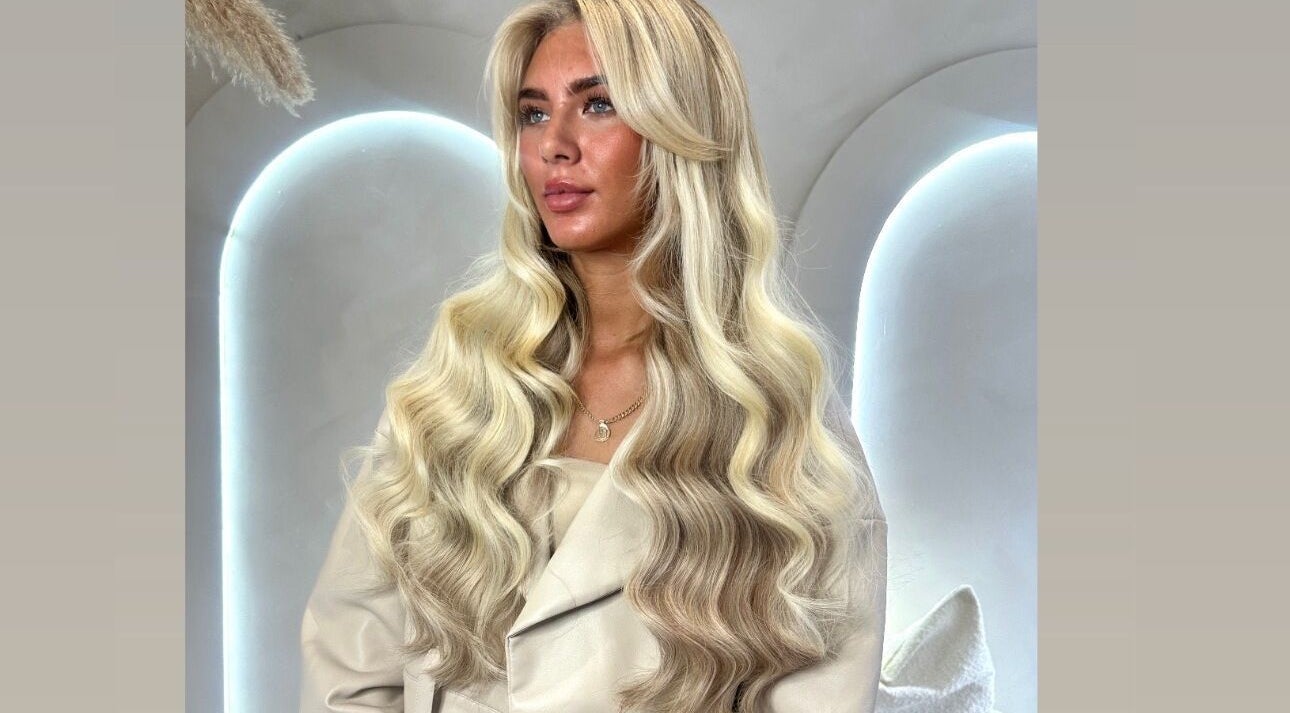 Glamorous long blond waves styled at Slae Salon, North Shields, England, GB.