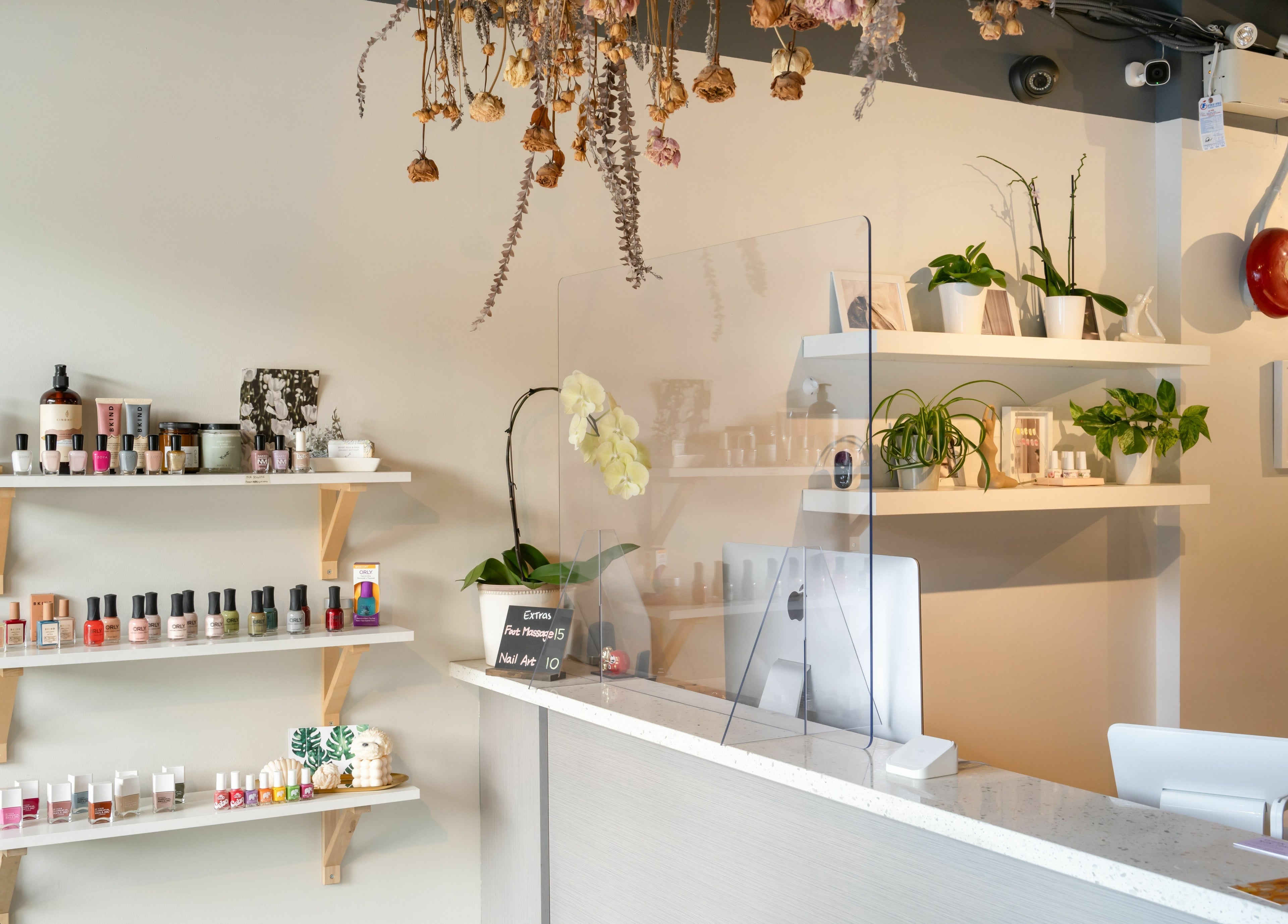 Reception desk with beauty products at Lily & Roo Nail Salon in Vancouver, British Columbia, CA.