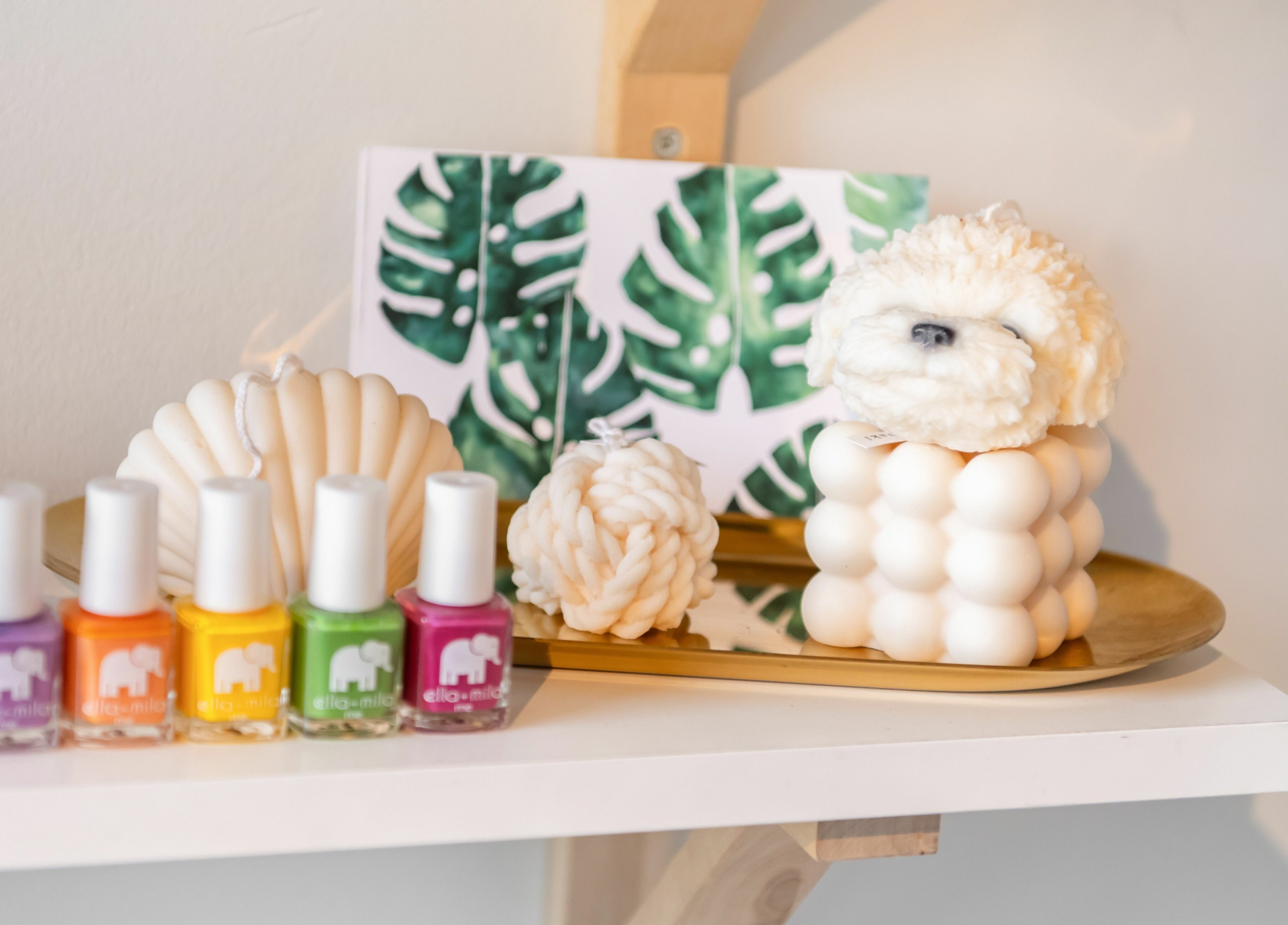 Colorful nail polishes and decor at Lily & Roo Nail Salon in Vancouver, British Columbia, CA.