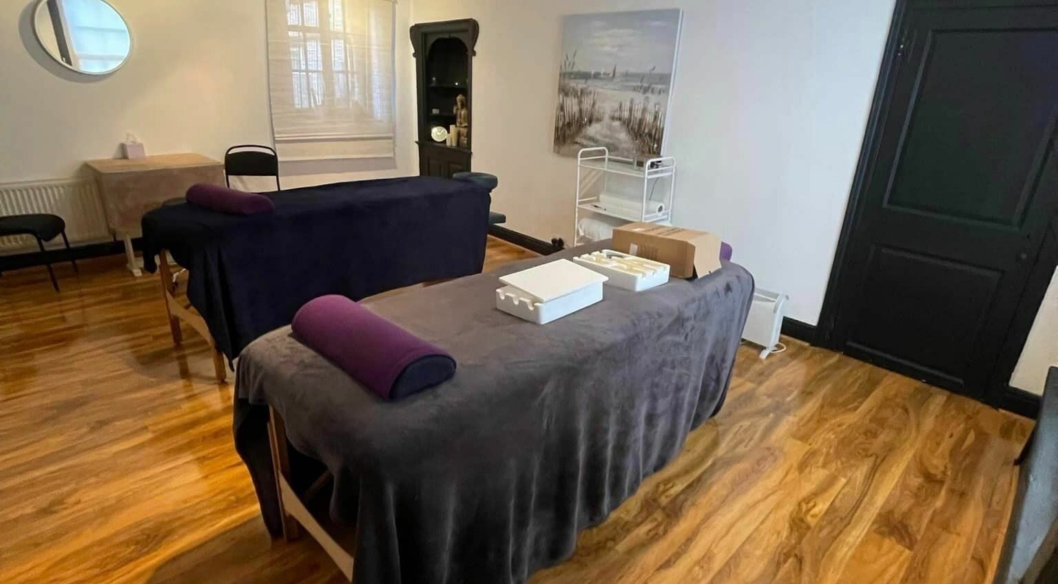 Inviting treatment room at The Lanes Clinic, Norwich, England, GB, featuring cozy massage tables.