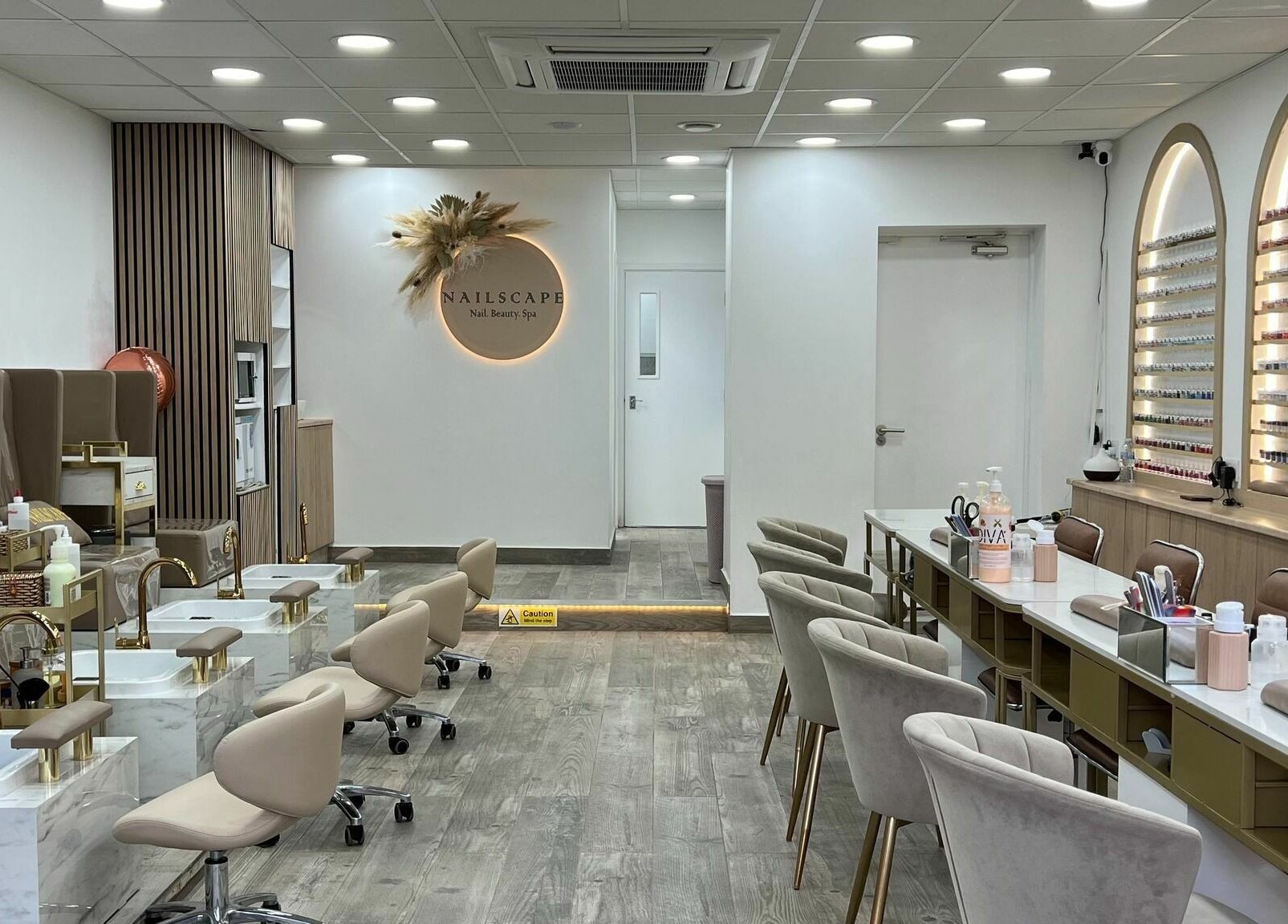 Interior of NAILSCAPE Ealing, a chic nail and beauty spa in London, England, GB with elegant decor and seating.
