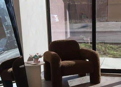 Inviting seating area at Vanilla Lash & Beauty, Melbourne, Victoria, AU with plush chair and decor.
