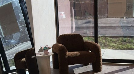 Inviting seating area at Vanilla Lash & Beauty, Melbourne, Victoria, AU with plush chair and decor.