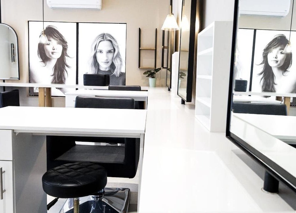 Modern interior of Salon at 102 in Rustenburg, North West, ZA, featuring stylish workstations and decor.