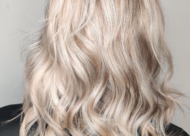 Blonde wavy hairstyle at Abbie Bellchambers Hair Salon, Shepshed, England, GB, showcasing chic styling.