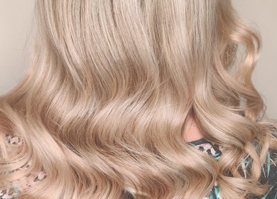 Blonde hairstyle with soft waves at Abbie Bellchambers Hair Salon in Shepshed, England, GB.