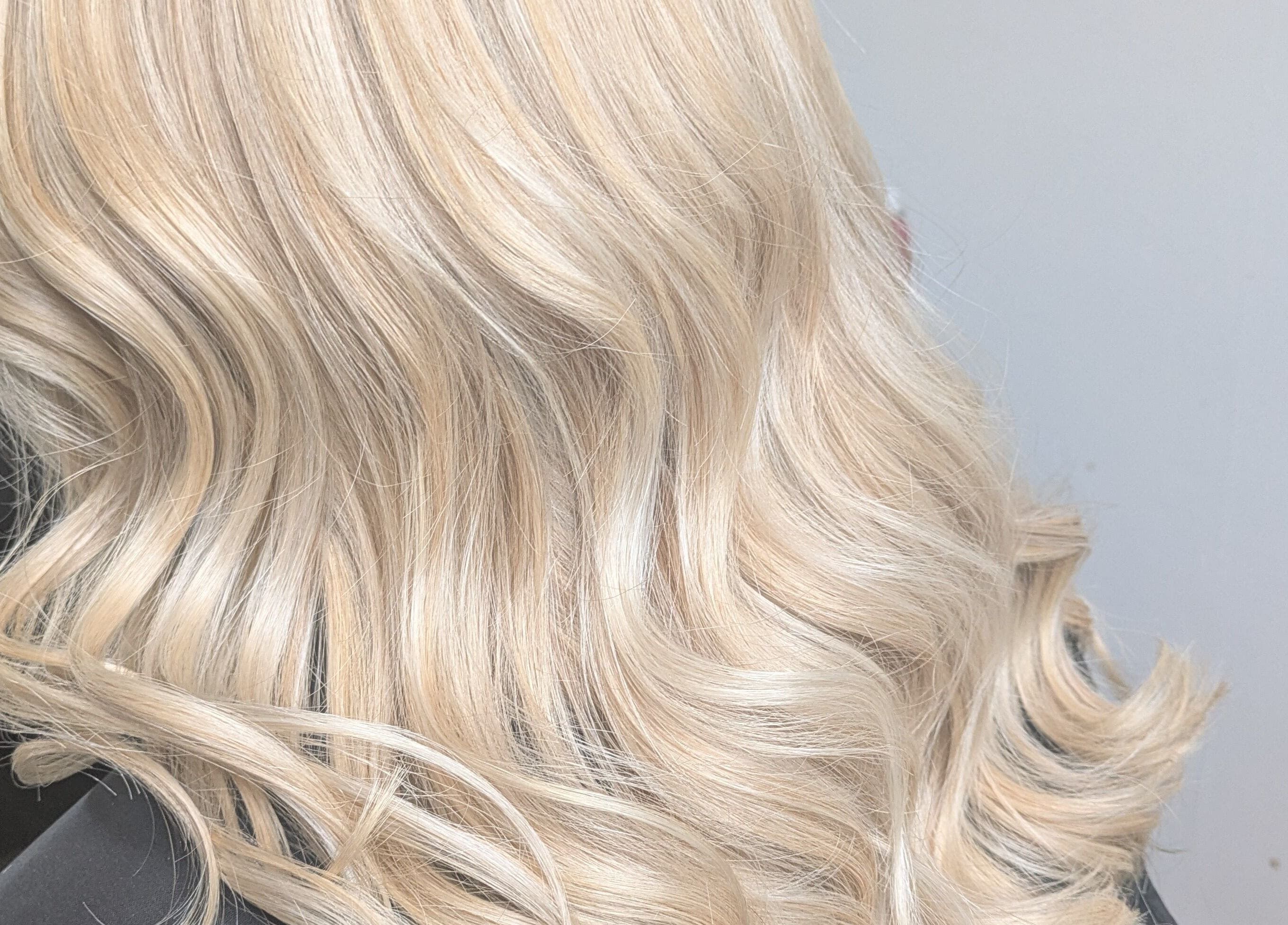Blonde wavy hair styled at Abbie Bellchambers Hair Salon, Shepshed, England, GB.