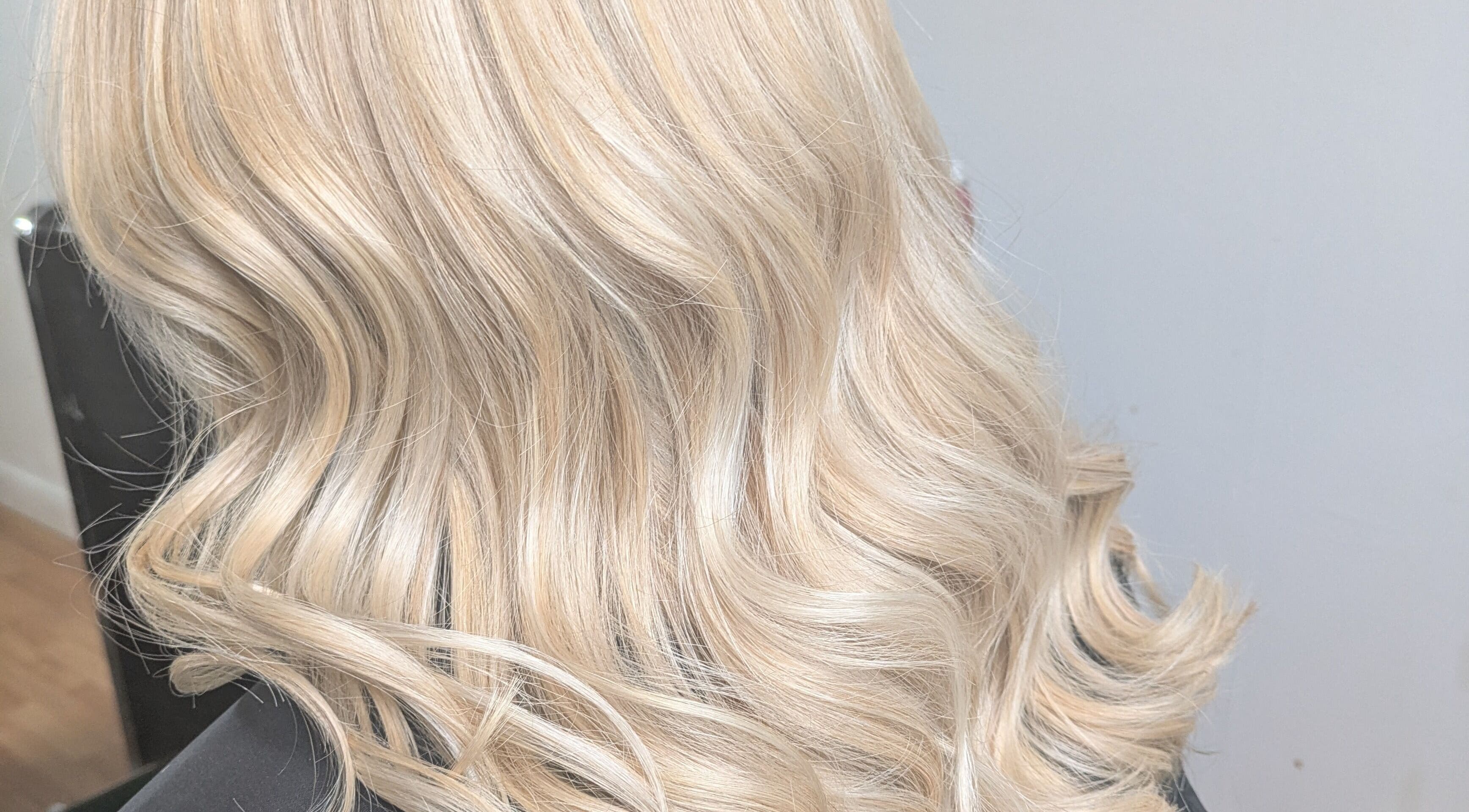 Blonde wavy hair styled at Abbie Bellchambers Hair Salon, Shepshed, England, GB.