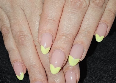 Stylish yellow-tipped nails at All Things Beauty in Wakefield, England, GB.