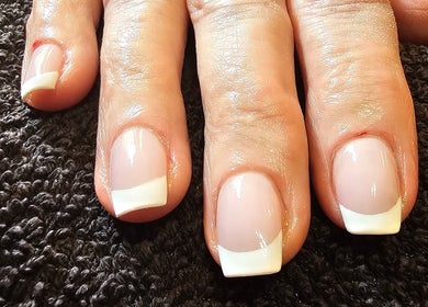 French pedicure at All Things Beauty, Wakefield, England, GB. Perfectly manicured toes on soft towel.