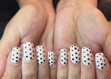 Stylish polka dot nails at All Things Beauty, Wakefield, England, GB. Perfect for a chic manicure look.