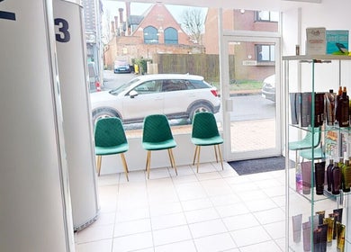Inviting waiting area at Glow By Eve - Skin, Bedworth, England, with chic chairs and product display.