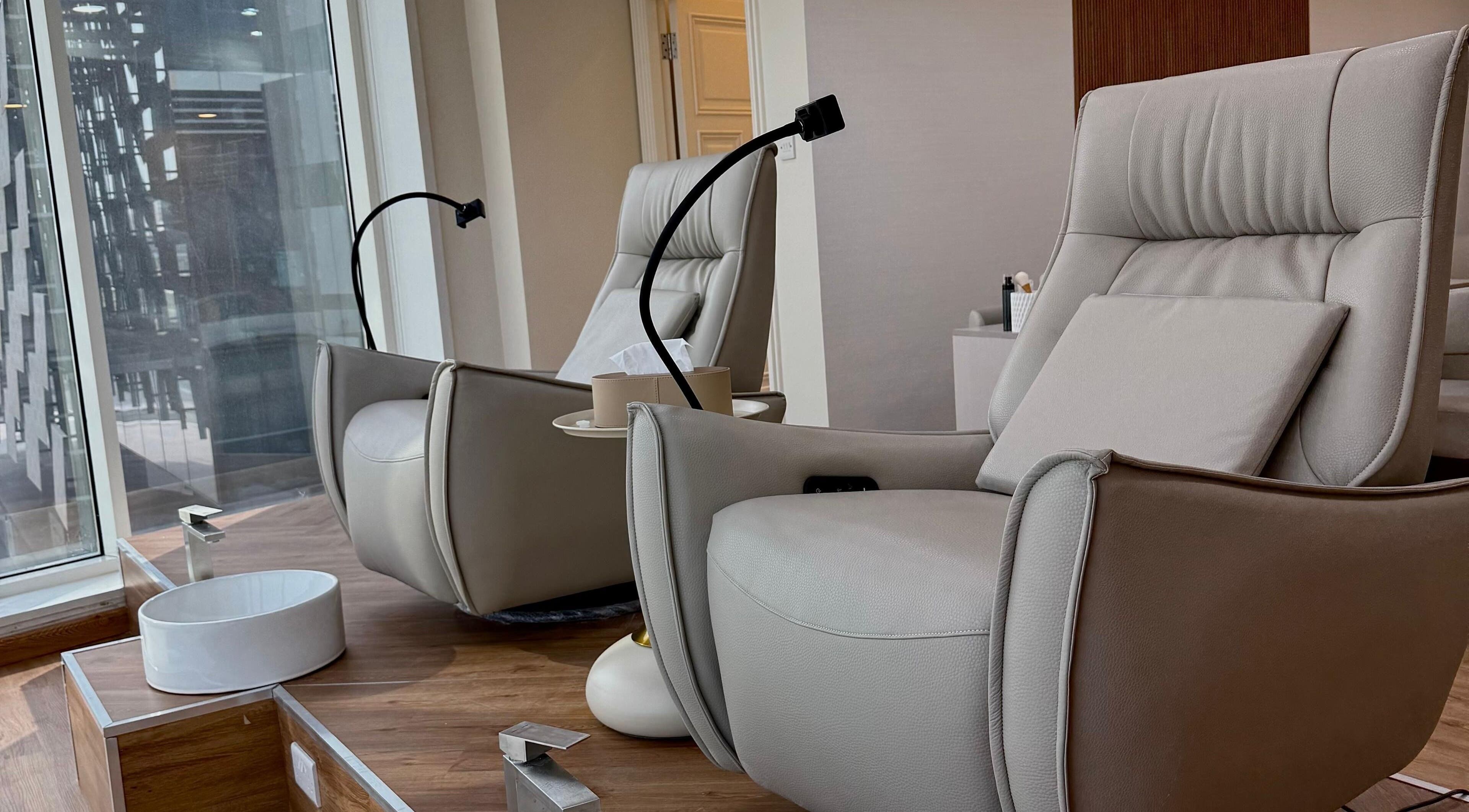 Luxurious lounge chairs at 13: Thirteen Beauty Lounge in Dubai, Dubai, AE, offering comfort and relaxation.