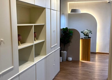 Modern interior at 13: Thirteen Beauty Lounge, Dubai, Dubai, AE with sleek shelving and a cozy atmosphere.