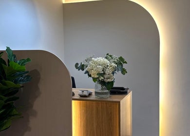 Elegant front desk with fresh flowers at 13: Thirteen Beauty Lounge, Dubai, Dubai, AE.