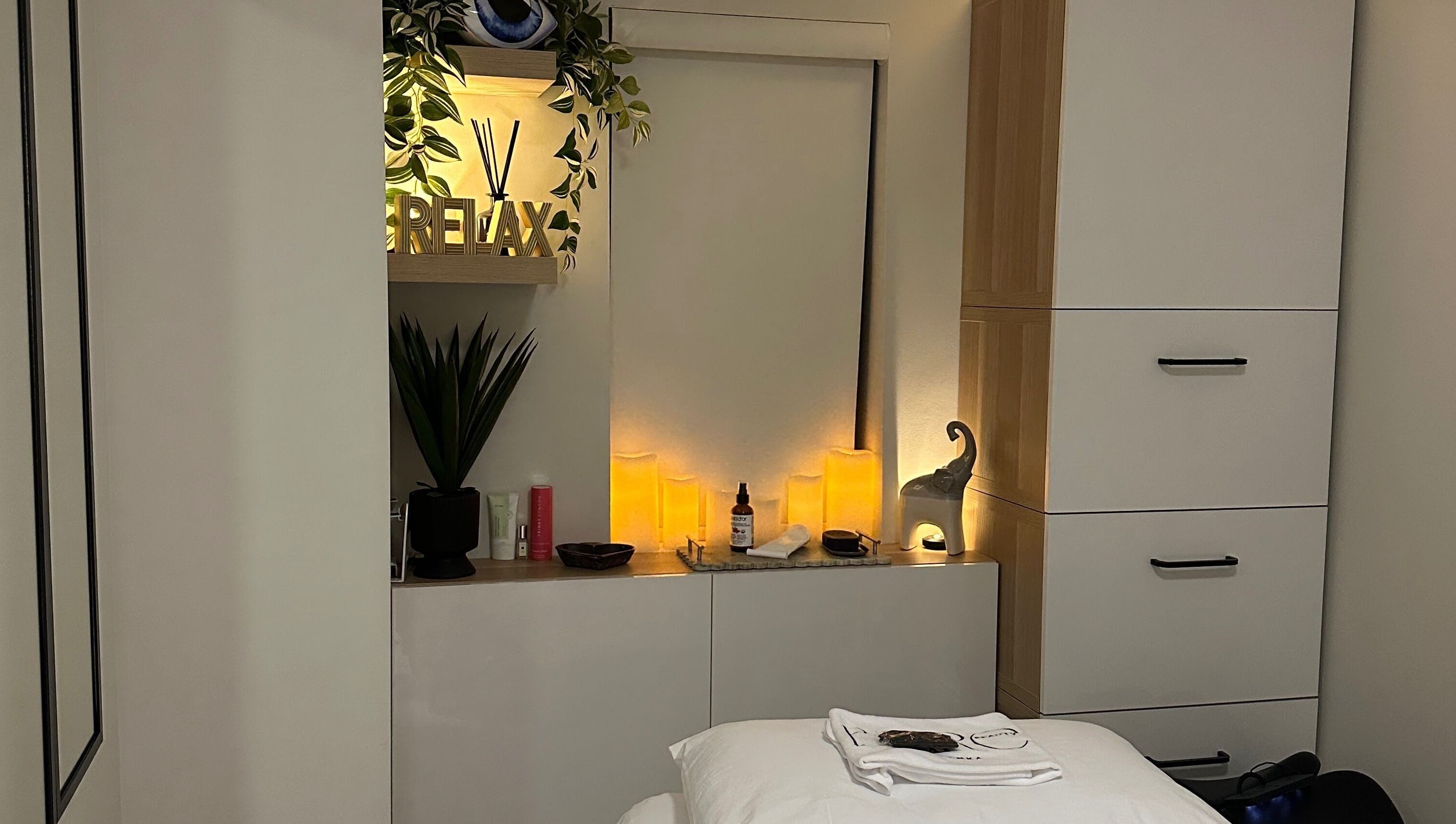 Calming spa room at BareBeauty By Bianka, Toronto, Ontario, CA with soft lighting and cozy treatment bed.