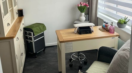Manicure station at Pampered Pinkies in Great Yarmouth, England, featuring chic decor and professional tools.