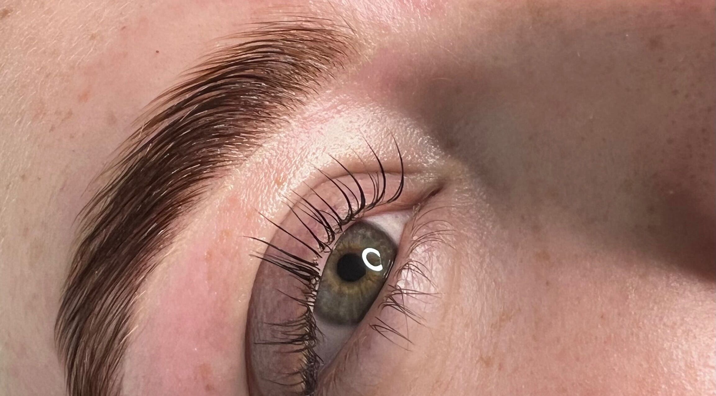 Close-up of perfectly shaped eyebrow at Sophie's beauty bar, Midhurst, England, GB.