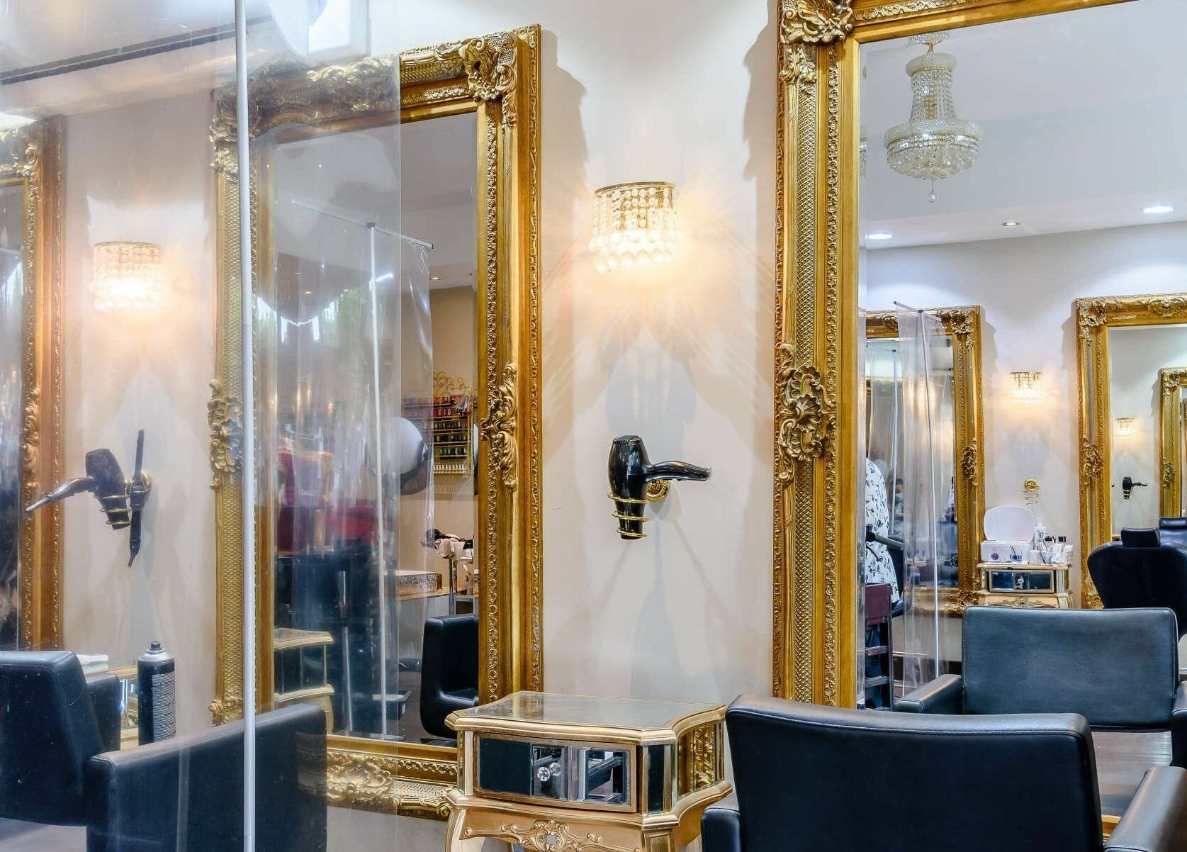 Elegant styling area at Wink Spa, featuring ornate gold mirrors in Feltham, England, GB.